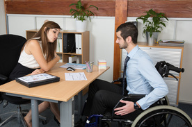 Picture of woman interviewing man in wheelchair